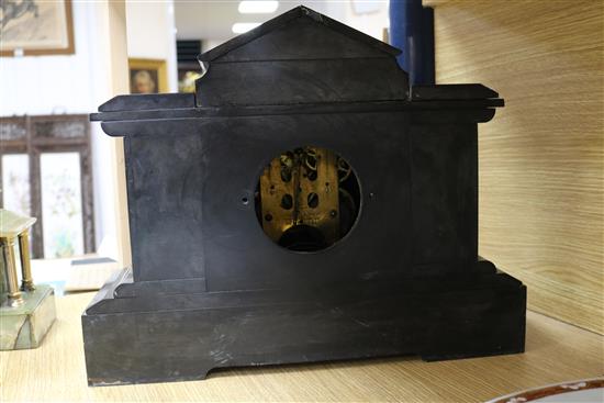 A Victorian black slate mantel clock and an onyx clock